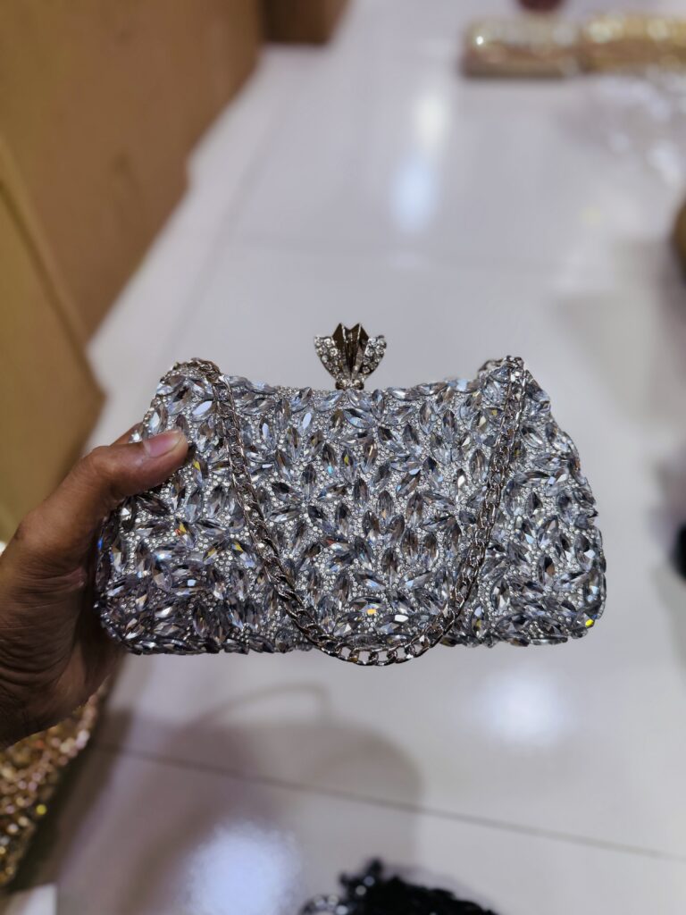 Silver crystal leaf party clutch with decorative clasp and chain